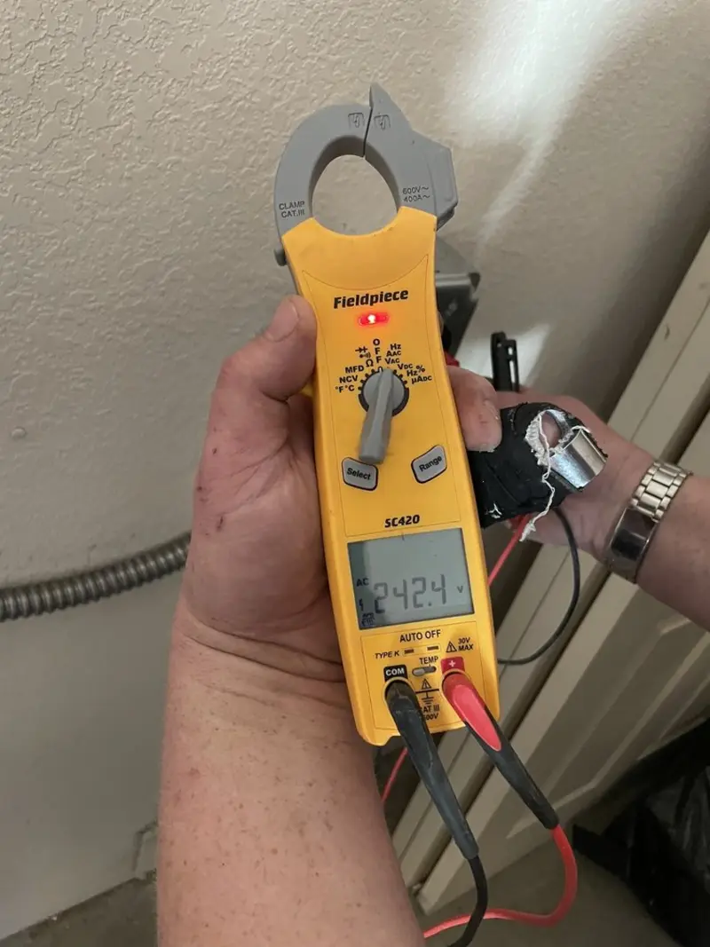Voltage testing with clamp meter during Whole House Surge Protector in Tallahassee
